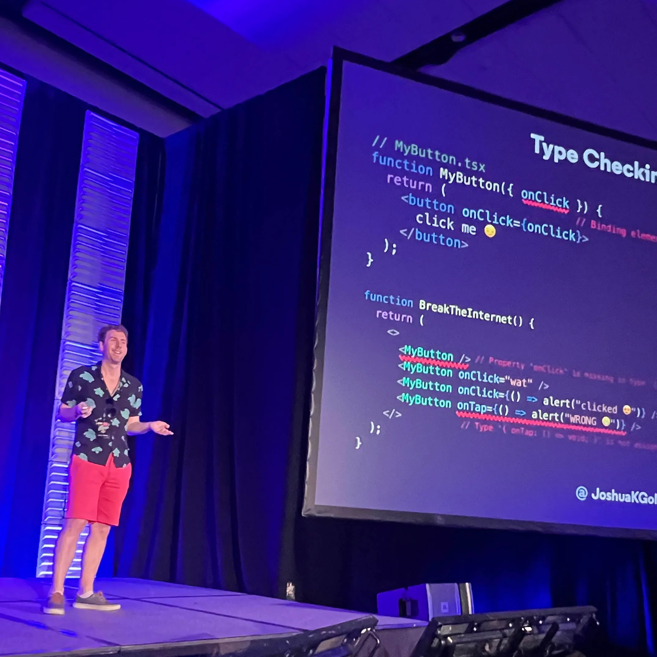 Josh smiling on stage and giving a presentation showing the "Type Checking React (v2)" from the linked slides.